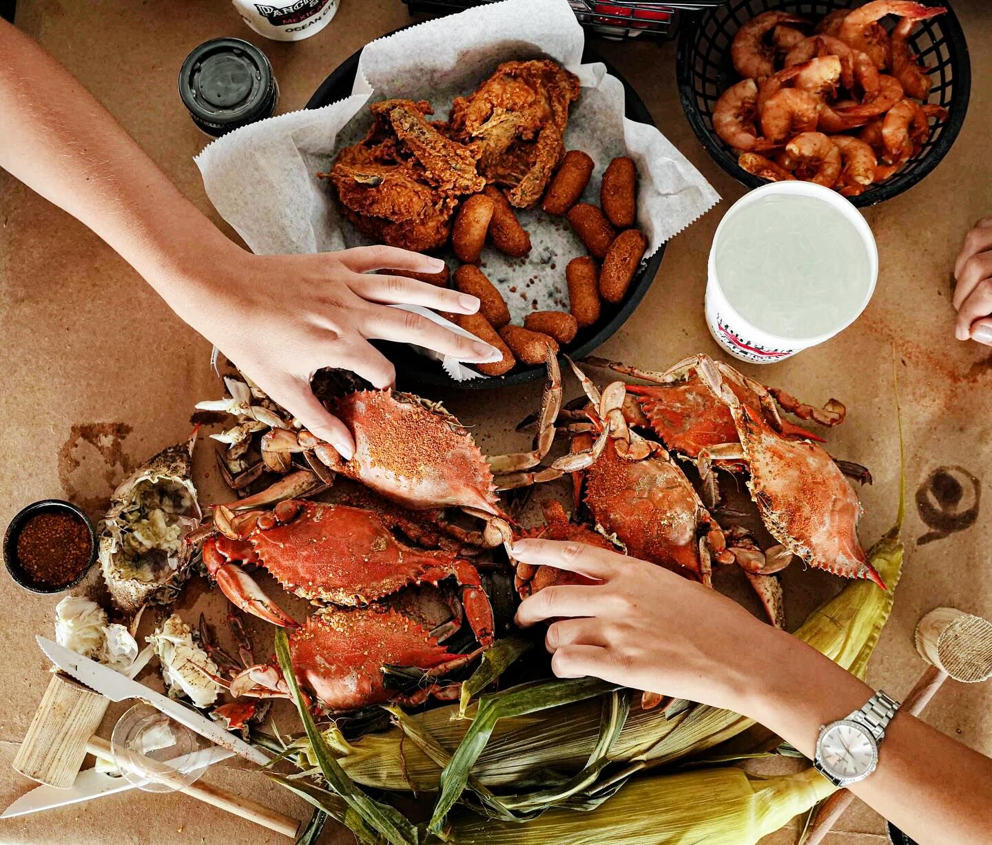Seasoned steamed crabs spread on brown paper at Hooper's Crab House