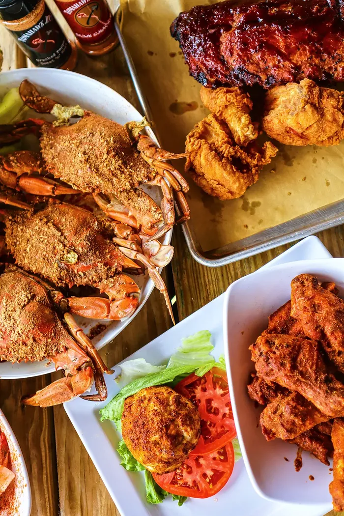 A spread of steamed crabs on brown paper