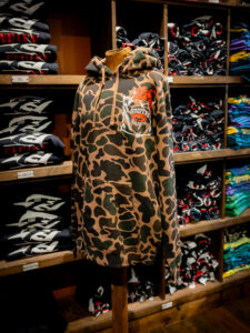 Front of hammered at Hoopers hoodie in camo