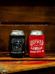 Black Sneaky Pete's and red Hooper's Crab House logo coozies